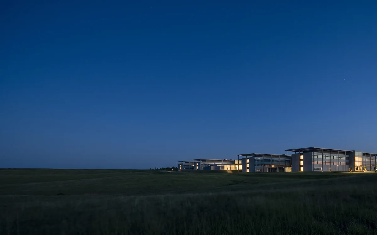 A large data centre campus lit at dusk